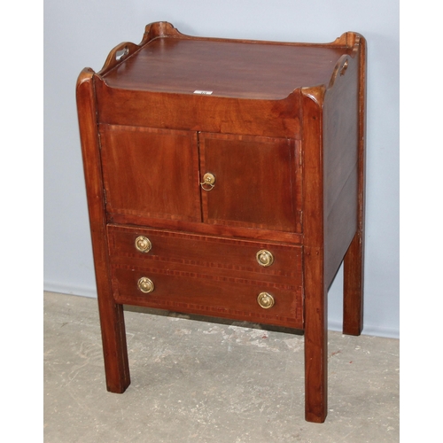 30 - A 19th century Mahogany tray topped bedside table or Commode with a single cupboard over a single dr... 