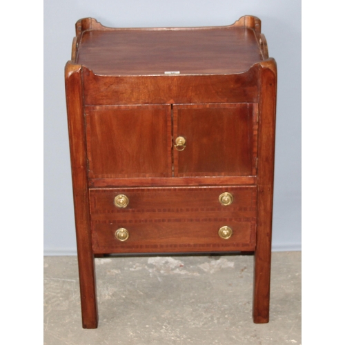 30 - A 19th century Mahogany tray topped bedside table or Commode with a single cupboard over a single dr... 