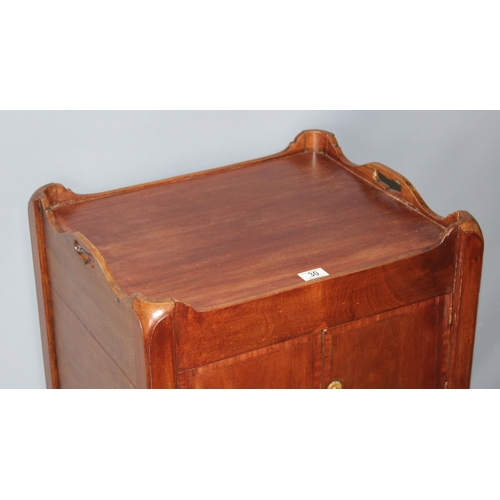 30 - A 19th century Mahogany tray topped bedside table or Commode with a single cupboard over a single dr... 