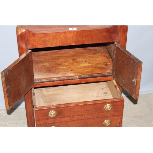 30 - A 19th century Mahogany tray topped bedside table or Commode with a single cupboard over a single dr... 