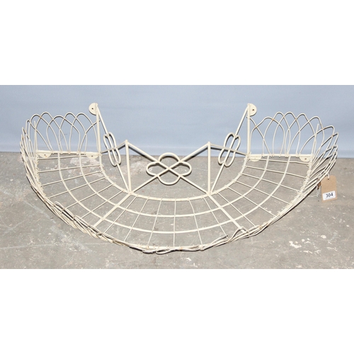 304 - A wirework garden planter designed to go around the trunk of a tree, approx 100cm wide