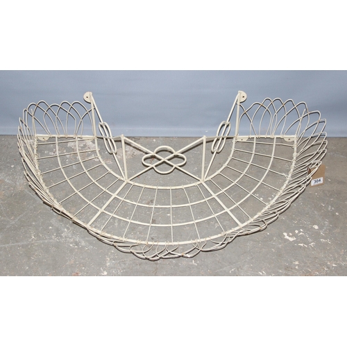 304 - A wirework garden planter designed to go around the trunk of a tree, approx 100cm wide