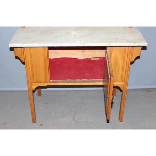 4 - An early 20th century Pine marble topped wash stand with tile back, approx 91cm wide