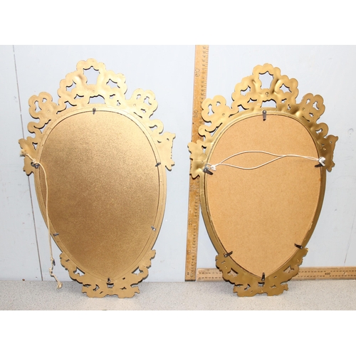 402 - A pair of antique style shield shaped gilt framed mirrors, each approx 65cm tall