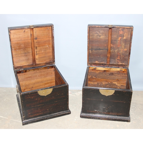 44 - A pair of Chinese black painted wooden storage boxed with brass clasps, unknown age, approx 50cm squ... 