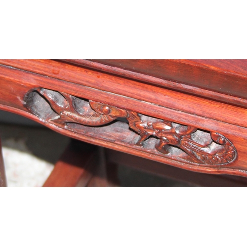 47 - A small Chinese carved hardwood table or jardinière stand with plain top and carved fretwork support... 