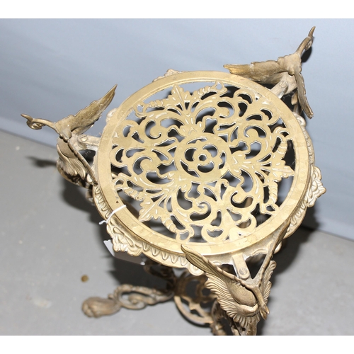 5 - A small Rococo style brass plant stand with lion paw feet, approx 56cm tall