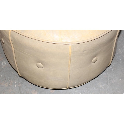 62 - A large light tan leather coloured pouffe or foot stool