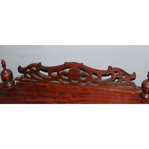 8 - An unusual antique style hall table with fretwork details and magazine rack and drawer to base, appr... 