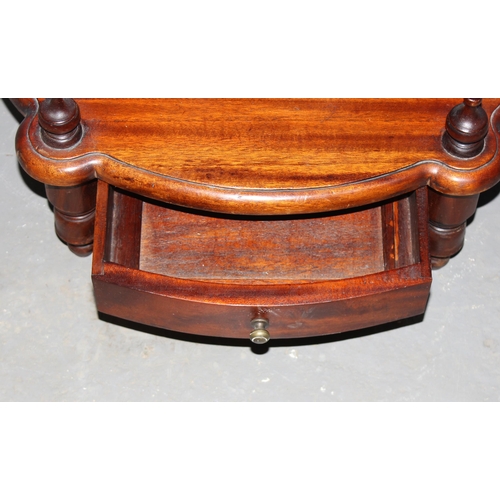 8 - An unusual antique style hall table with fretwork details and magazine rack and drawer to base, appr... 