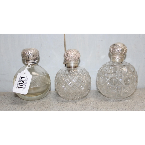 1021 - 3 silver topped grenade shaped perfume bottles, Birmingham 1894 & 1902 & London 1897, each with glas... 