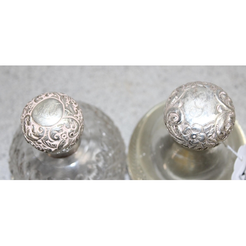 1021 - 3 silver topped grenade shaped perfume bottles, Birmingham 1894 & 1902 & London 1897, each with glas... 