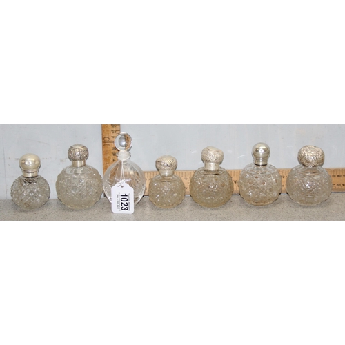 1023 - 7 assorted smaller grenade shaped perfume bottles, 6 with silver tops, various dates and makers, mai... 