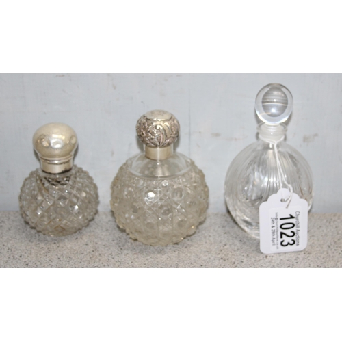 1023 - 7 assorted smaller grenade shaped perfume bottles, 6 with silver tops, various dates and makers, mai... 