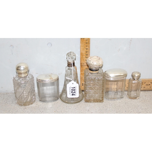 1024 - 6 assorted silver topped scent bottles and dressing table jars, mainly late 19th or early 20th centu... 