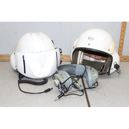 1402 - 2 Gentex pilots helmets and headphones PA 18407 FSCM 97427 and a pair of Astrocom vintage headphones