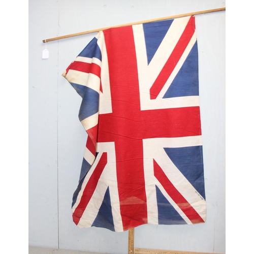 1403 - 7 vintage c.1940's and 1950's British made Union Jack parade flags, 5 on poles, the largest approx 1... 