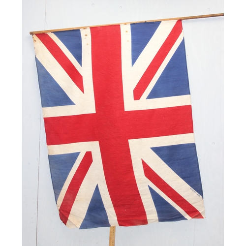 1403 - 7 vintage c.1940's and 1950's British made Union Jack parade flags, 5 on poles, the largest approx 1... 