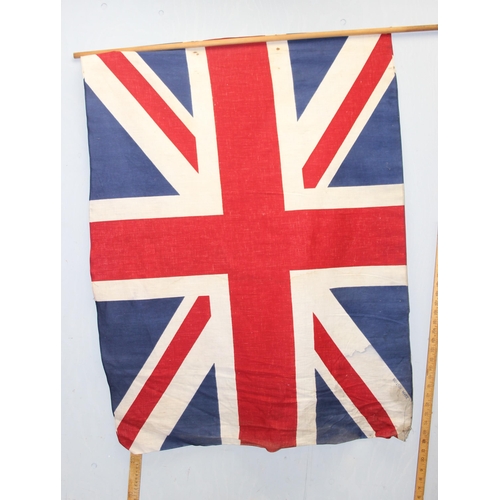 1403 - 7 vintage c.1940's and 1950's British made Union Jack parade flags, 5 on poles, the largest approx 1... 