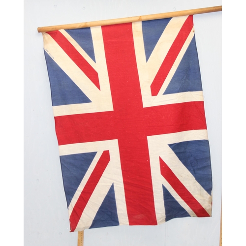 1403 - 7 vintage c.1940's and 1950's British made Union Jack parade flags, 5 on poles, the largest approx 1... 