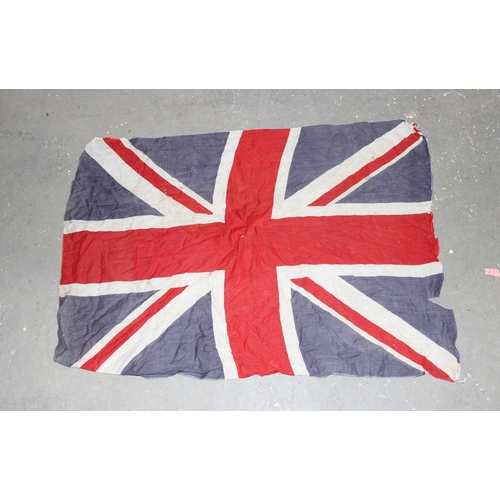 1403 - 7 vintage c.1940's and 1950's British made Union Jack parade flags, 5 on poles, the largest approx 1... 