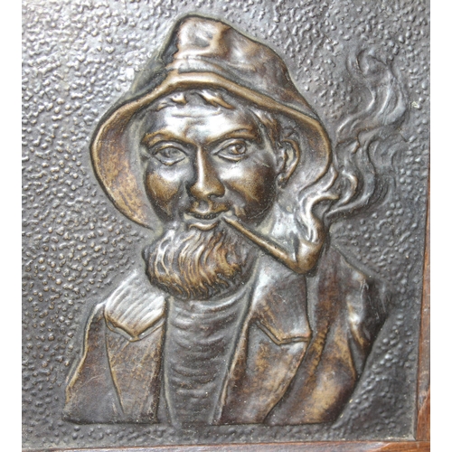 409 - 2 wooden framed metal relief plaques, copper embossed copper plaque of a fisherman and a cast iron p... 