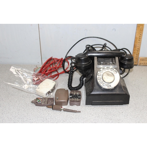 702 - Vintage Bakelite telephone model number 328L FWR67/2A and a vintage pocket voltmeter