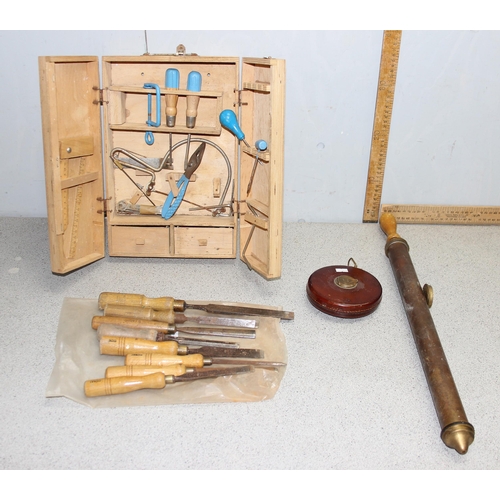 851 - Qty of chisels, children's wooden toolbox and contents, leather covered tape measure and a brass spr... 