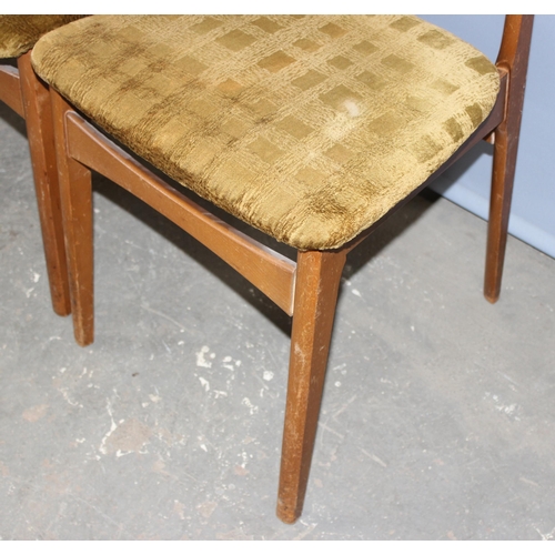 115 - A set of 4 retro Scandinavian style dining chairs, remnants of labels to base but unmarked