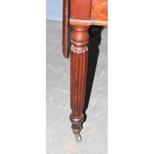 120 - An antique mahogany Pembroke table with reeded legs, single drawer and brass castors, approx 116cm w... 