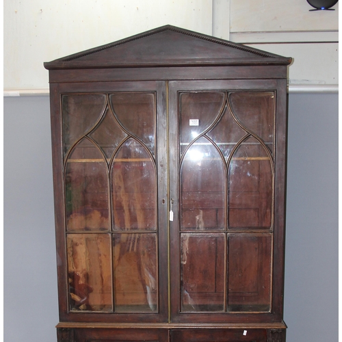 105 - Antique mahogany glazed bookcase over large shelved cupboard, approx 220cm