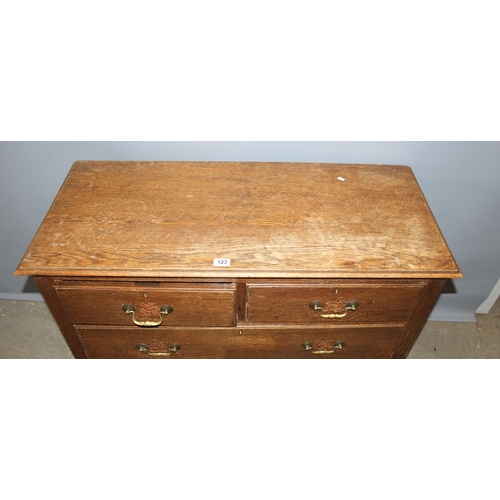 123 - Antique oak 2 over 2 chest of drawers with brass swan neck drop handles, approx 107cm wide