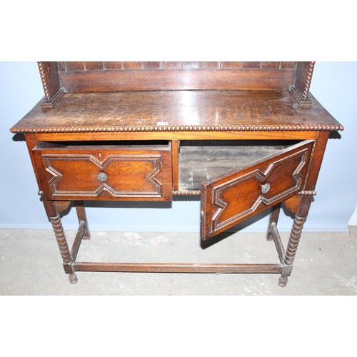 124 - Jacobean style oak dresser on bobbin turned supports, approx 193cm tall x 100cm wide