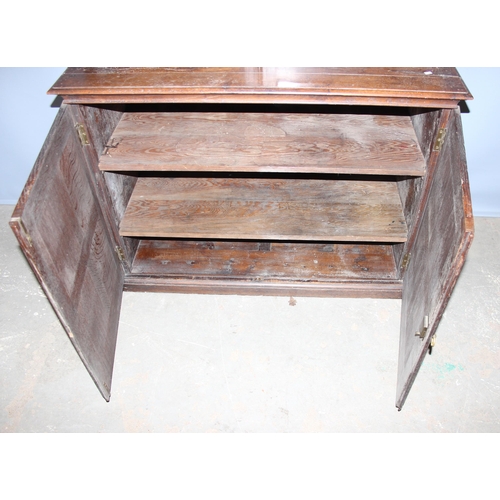 126 - Vintage oak glazed bookcase over double door cupboard, approx 120cm wide x 196cm high.