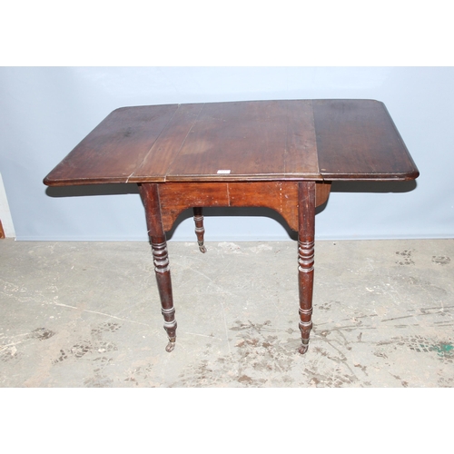 127 - Victorian mahogany Pembroke table on ceramic castors, when extended measures approx 122cm x 90cm