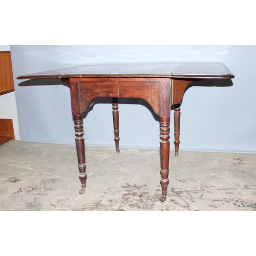 127 - Victorian mahogany Pembroke table on ceramic castors, when extended measures approx 122cm x 90cm