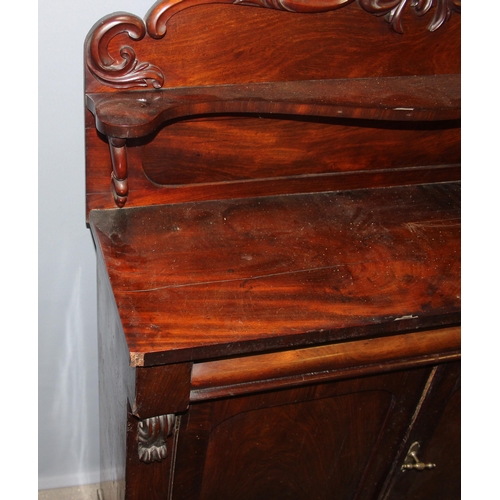 128 - A 19th century mahogany hall cupboard with well carved Fleur-de-Lys finial, single drawer over 2 cup... 