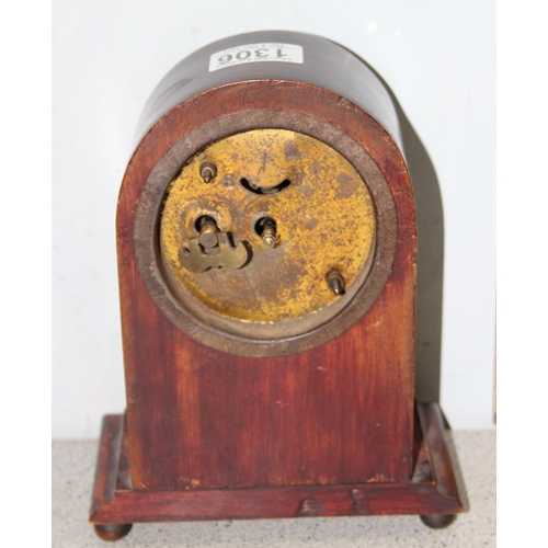 1306 - An early 20th century Sheraton revival inlaid mahogany mantle clock with mechanical movement