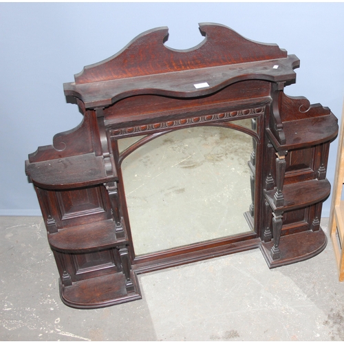 131 - Light wood folding book shelf & a carved mahogany framed over mantle mirror (2)