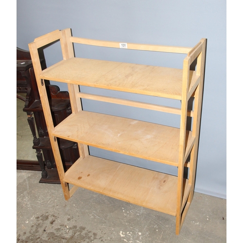 131 - Light wood folding book shelf & a carved mahogany framed over mantle mirror (2)