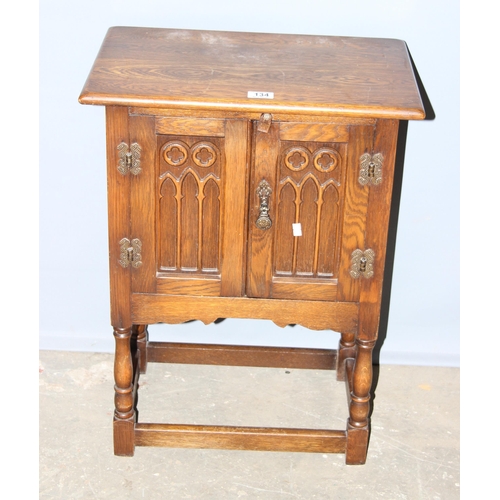 134 - Early 20th century carved oak pot cupboard, approx 50cm wide