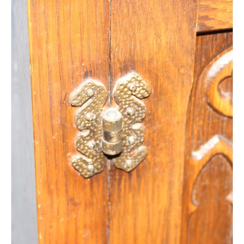 134 - Early 20th century carved oak pot cupboard, approx 50cm wide