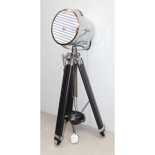 239 - Large chrome theatre spotlight style lamp on ebonised wood and chrome fitted tripod stand. 21 cm dia... 