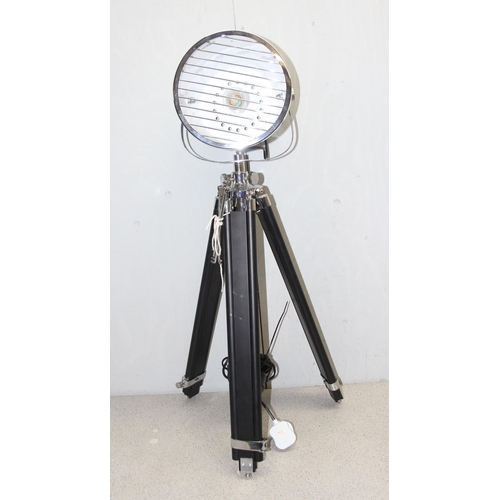 239 - Large chrome theatre spotlight style lamp on ebonised wood and chrome fitted tripod stand. 21 cm dia... 