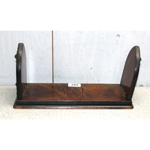 282 - Victorian mahogany and walnut veneered gothic style brass mounted extending bookstand