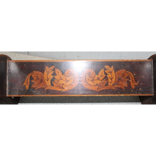 285 - Sheraton inlayed mahogany book trough and a pair carved bellows with grapevine detail