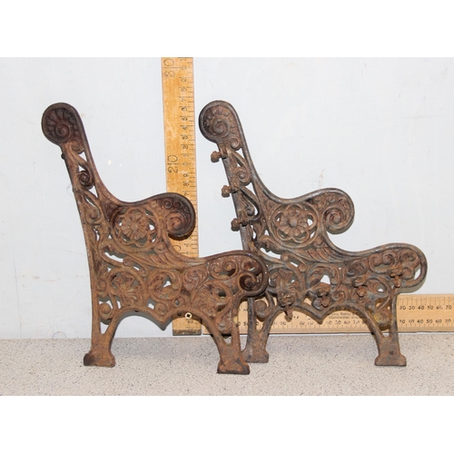 312 - A pair of miniature cast iron bench ends and a cast iron garden water pump