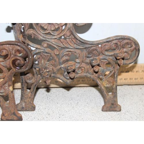 312 - A pair of miniature cast iron bench ends and a cast iron garden water pump