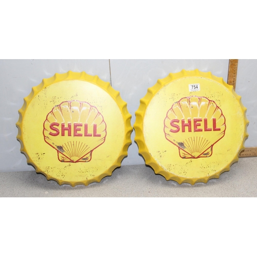 754 - Pair of large bottle top shaped iconic ‘Shell’ petrol wall signs with fixings, 40cm diameter.