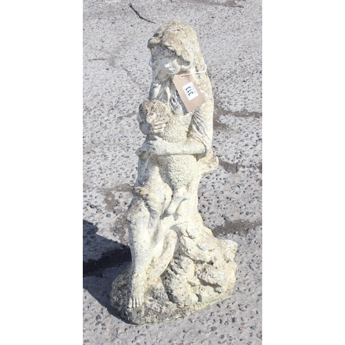 313 - Large stone garden statue of a woman with a dog, approx 75cm tall